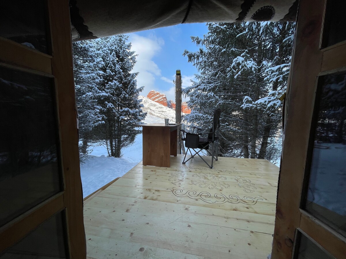 Doorway view of the yurt looking out at the Seven Bulls rock